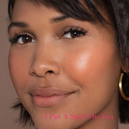 ILIA Multi-Stick - Shade: I Put a Spell On You (HOT TANGERINE WITH BRIGHT PEACHY UNDERTONES) on dark skin toned model - AILLEA