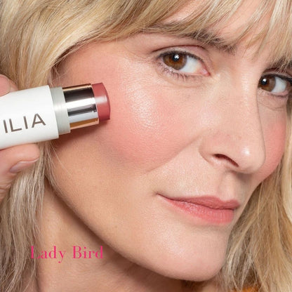 ILIA Multi-Stick - Shade: Lady Bird (NEUTRAL ROSE WITH PINK AND BROWN UNDERTONES) on light skinned model - AILLEA