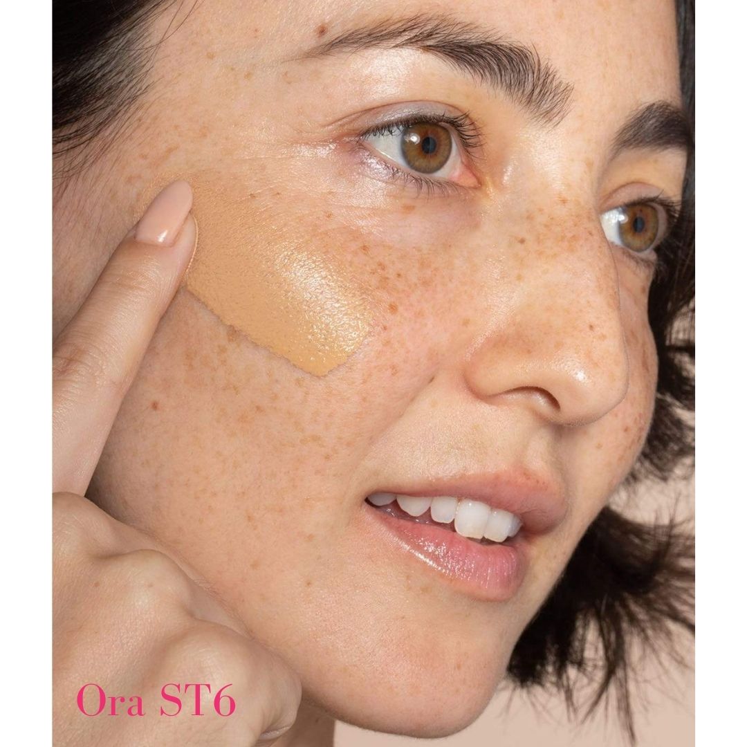 ILIA Super Serum Skin Tint SPF 40 ST6 Ora: (for light skin with warm undertones) on model  - AILLEA