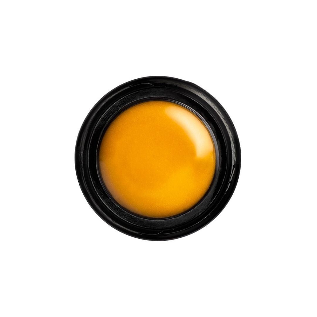 Henné Organics - Henne Organics- Lip Mask Aerial Product Shot - Golden yellow lip balm  - AILLEA