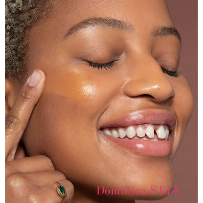 ILIA Super Serum Skin Tint SPF 40 ST14 Dominica: (for dark skin with neutral undertones) on model - AILLEA