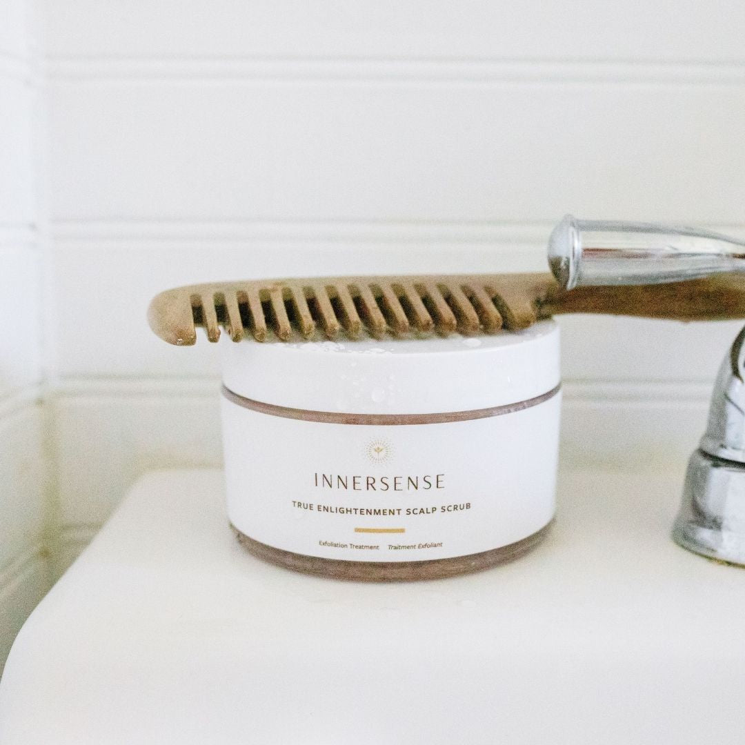 INNERSENSE TRUE ENLIGHTENMENT SCALP SCRUB Life Style shot with sink and comb - AILLEA